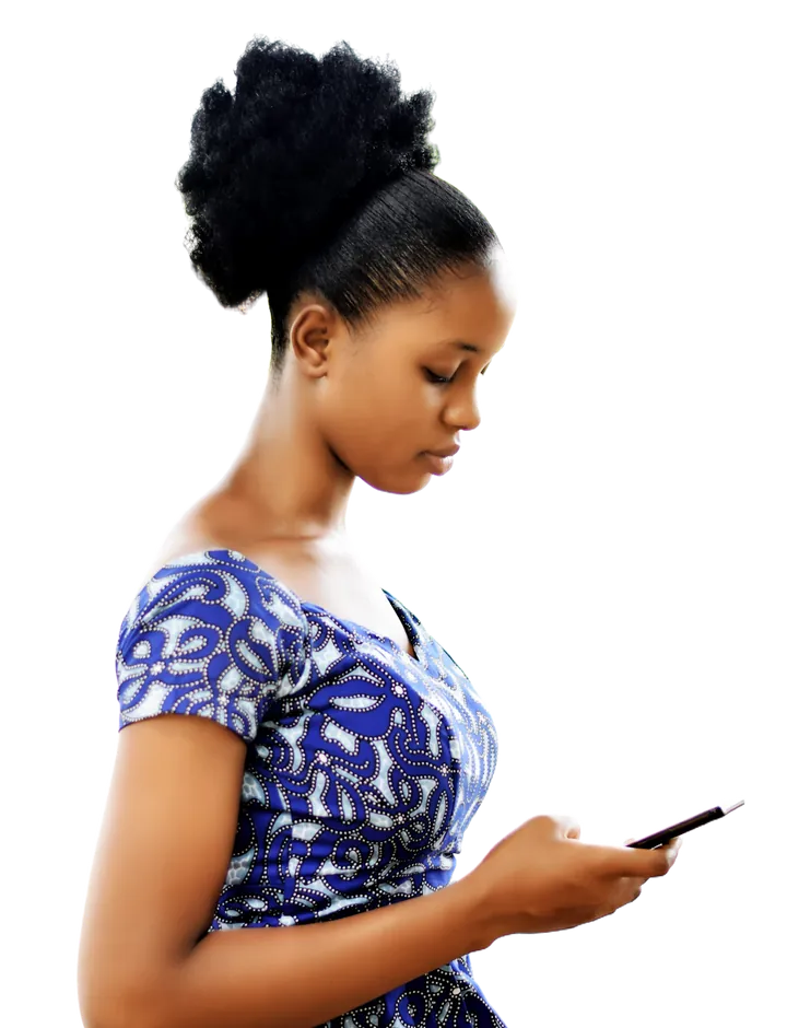 A young woman in a blue ankara dress looking at her phone